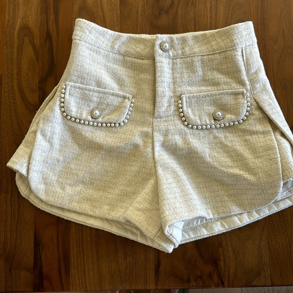 Cream and gold shorts with embellishments